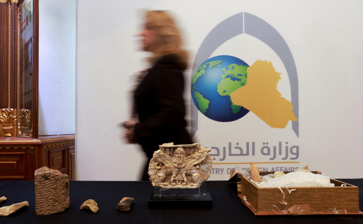 Ancient artifacts, that were stolen from Iraq and returned after they were seized by the US government, are displayed at the Ministry of Foreign Affairs in Baghdad on July 8, 2024. (Reuters)