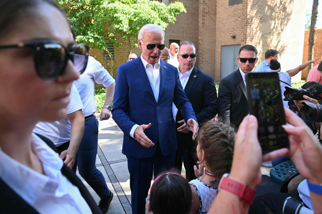 US President Joe Biden reacts to children while greeting supporters and volunteers during a campaign stop at a Biden-Harris campaign office in Harrisburg, Pennsylvania, on July 7, 2024. (AFP)