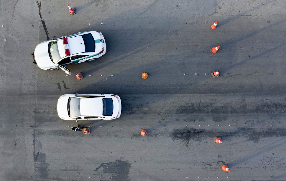 Above, Saudi police cars at a junction on the King Fahad road on May 24, 2020. Saudi Arabia has heavy penalties for drug-related crimes. (AFP file photo)