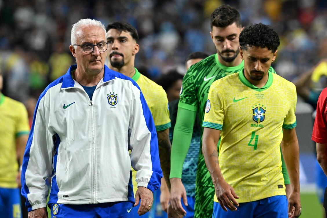 Brazil’s coach Dorival Junior and defender Marquinhos react after their team’s defeat in the Conmebol 2024 Copa America tournament quarter-final match against Uruguay at Allegiant Stadium in Las Vegas, Nevada on Jul. 6, 2024. (AFP)