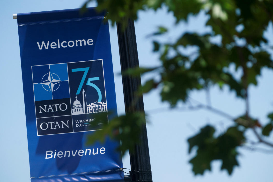 A banner promoting the NATO 75th anniversary celebratory event is seen outside the Walter E. Washington Convention Center in Washington DC. (Reuters)