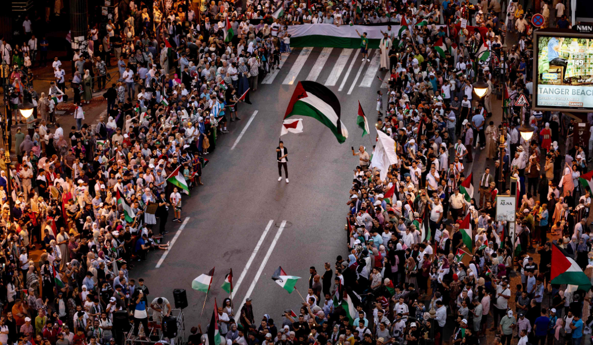A man waves a Palestinian national flag during a march in solidarity with the people of Gaza in the city of Tangier on July 7, 2024. (AFP)