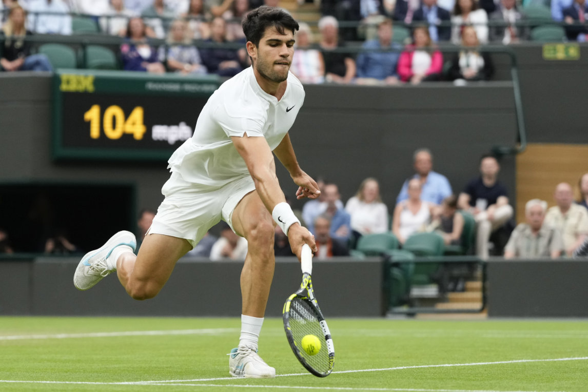 Carlos Alcaraz of Spain plays a forehand return to Tommy Paul of the US during their quarterfinal match at the Wimbledon tennis championships in London Tuesday. (AP)