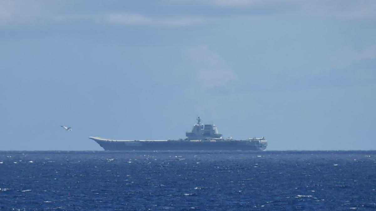 Above, the Chinese navy’s aircraft carrier Shandong sails in the Pacific Ocean southeast of Miyakojima, Okinawa prefecture to conduct joint sea and air training. (Japan’s Ministry of Defense/AFP)