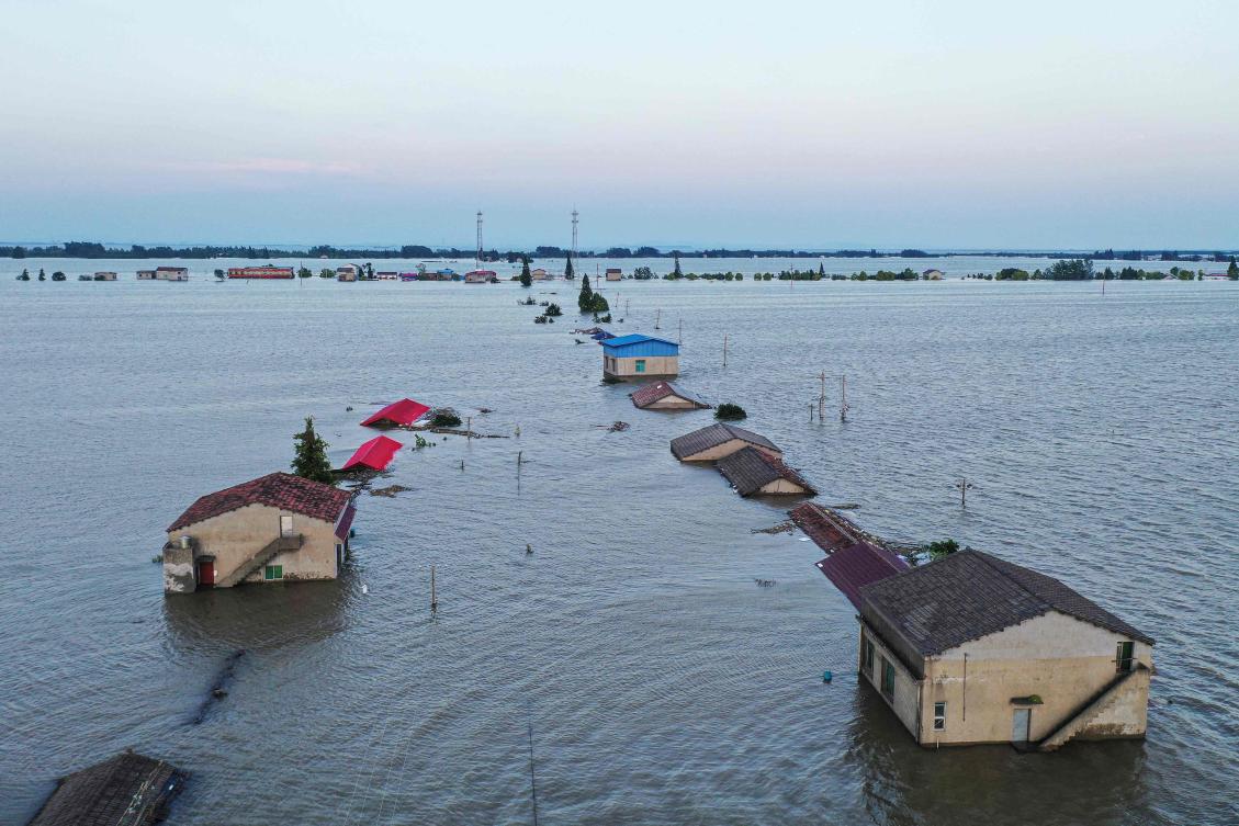 Swathes of northern China have already been baked by heat waves this summer, while unseasonably torrential rains have triggered deadly floods and landslides across much of the south. (AFP)