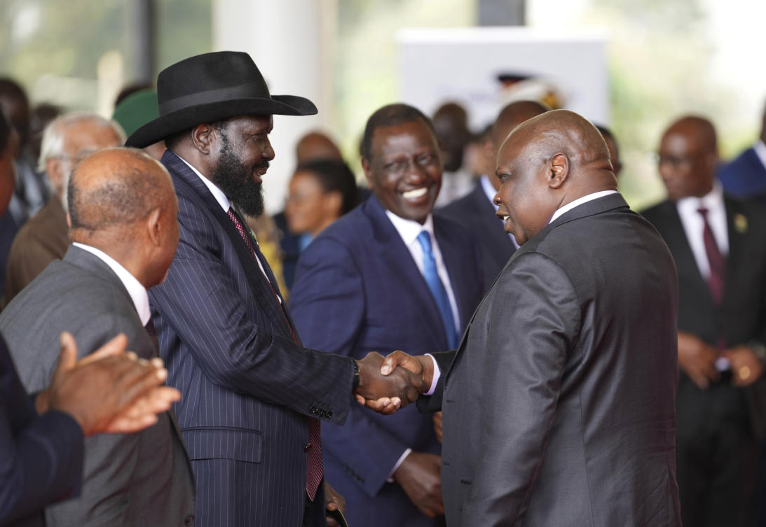 South Sudanese President Salva Kiir Mayardit, left, shakes hands with Pagan Amum Okiech, leader of the Real-SPLM group, during the launch of high-level peace talks for South Sudan at State House in Nairobi, Kenya on May 9, 2024. (AP)