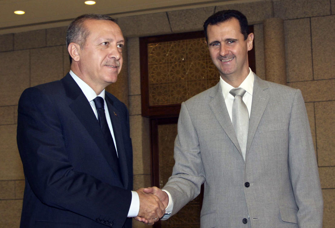 FILE — Syrian President Bashar Assad, right, shakes hands with Turkish Prime Minister Recep Tayyip Erdogan at Al-Shaab presidential palace in Damascus, Syria, on Oct. 11, 2010.(AP)