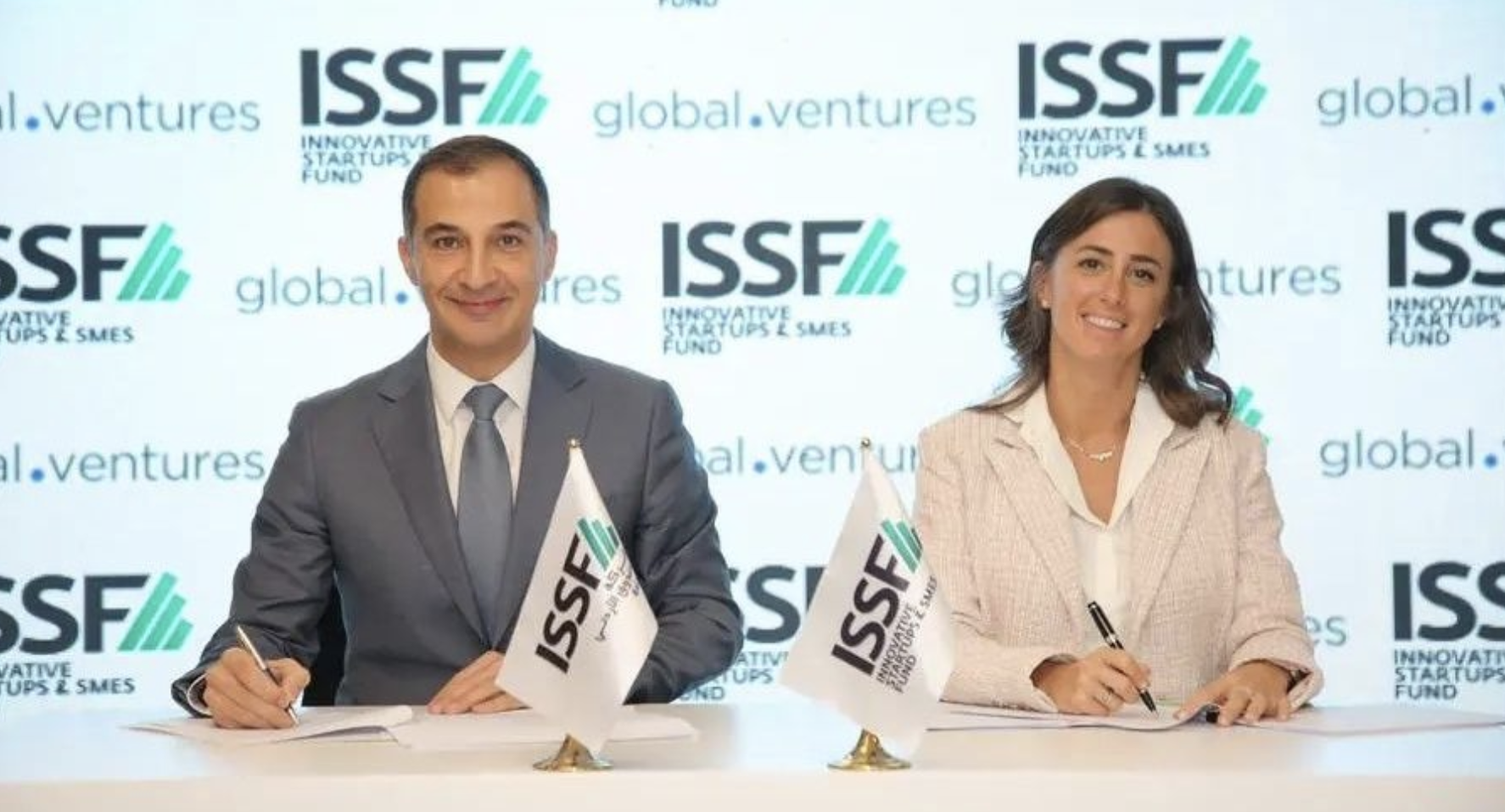 Mohammed Al Muhtaseb, ISSF CEO, and Noor Sweid, Global Ventures’ managing partner, sign a funding agreement. Supplied