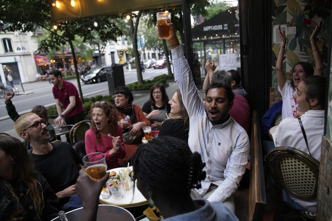 People react to the projection of results during the second round of the legislative elections, near Republique Plaza in Paris on July 7, 2024. (AP/File)