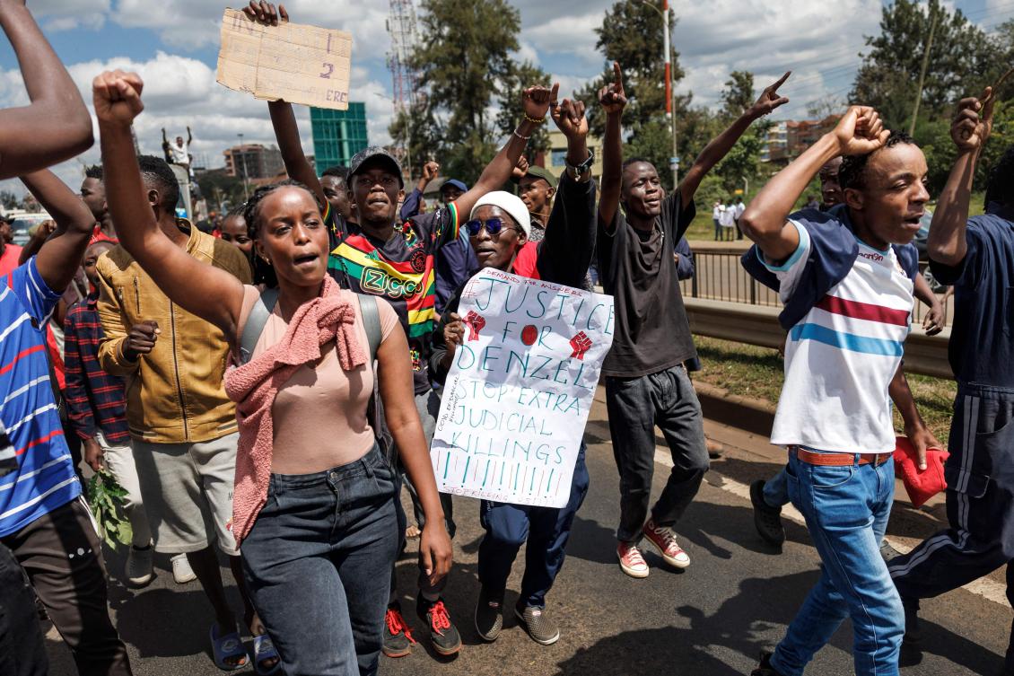 Students from Jomo Kenyatta University of Agriculture and Technology carry posters calling for justice for the death of their comrade following deadly anti-government protests two weeks ago in Nairobi on Jul. 12, 2024. (AFP)