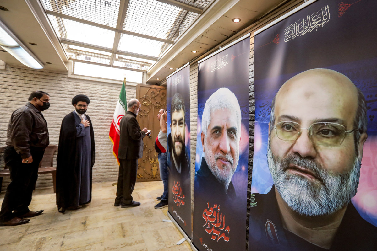 Posters depicting victims of an air strike on the consular annex of the Iranian embassy's headquarters in Damascus are displayed during a memorial service for them at the premises in the Syrian capital on April 3, 2024. (AFP)
