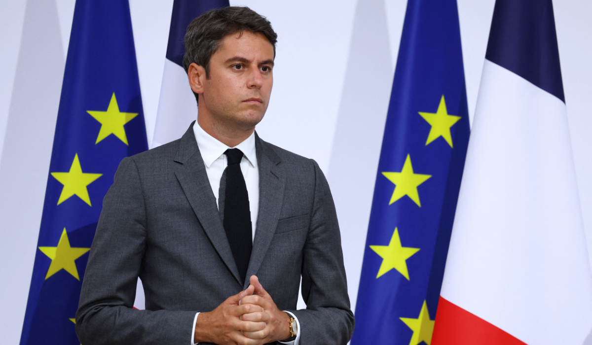 French Prime Minister Gabriel Attal listens as French President Emmanuel Macron (not pictured) gives a speech to the French Military Forces, at the Hotel de Brienne in Paris, France, July 13, 2024. (REUTERS)