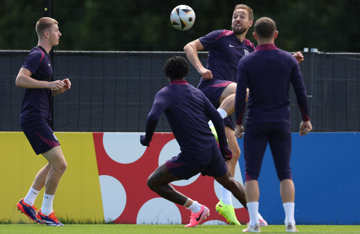 (From L) England's midfielder #25 Adam Wharton, England's midfielder #26 Kobbie Mainoo, England's forward #09 Harry Kane and England's defender #12 Kieran Trippier attend an MD-1 training session at the team's base camp in Blankenhain, on July 13, 2024, on the eve of their UEFA Euro 2024 final football match against Spain. (AFP)