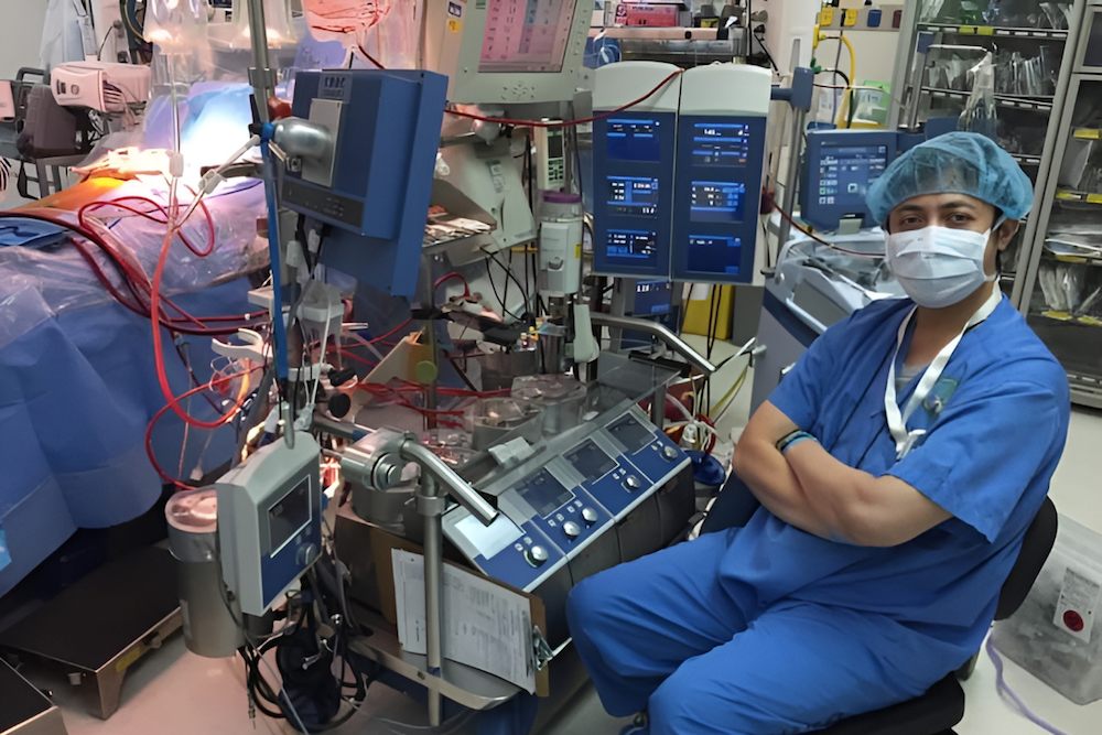 Ade Koswara, a perfusionist at the King Faisal Specialist Hospital and Research Center in Riyadh, sits besides a perfusion machine in this photo shared on July 14, 2024. (Supplied/Ade Koswara)