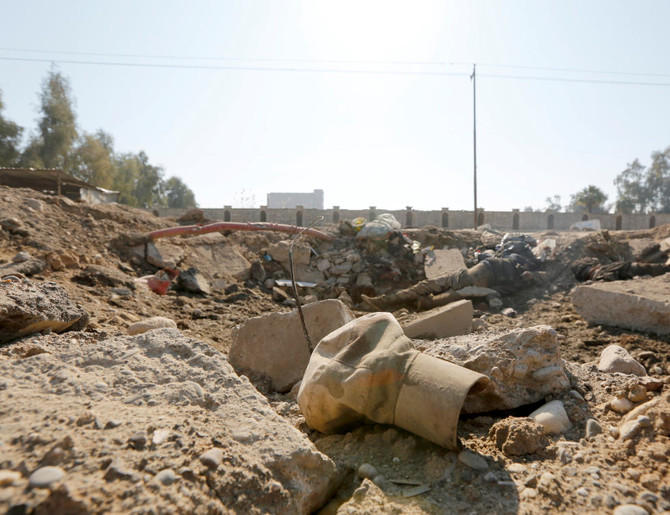 A military hat is seen near bodies of Daesh militants killed in clashes in Mosul, Iraq, on February 6, 2017. (Reuters/File Photo)
