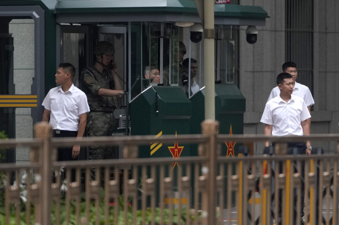 Chinese security personnel stand on duty at the entrance to Jingxi Hotel where the Communist Party's Central Committee is holding its third plenum in Beijing, China, Monday, July 15, 2024. (AP)