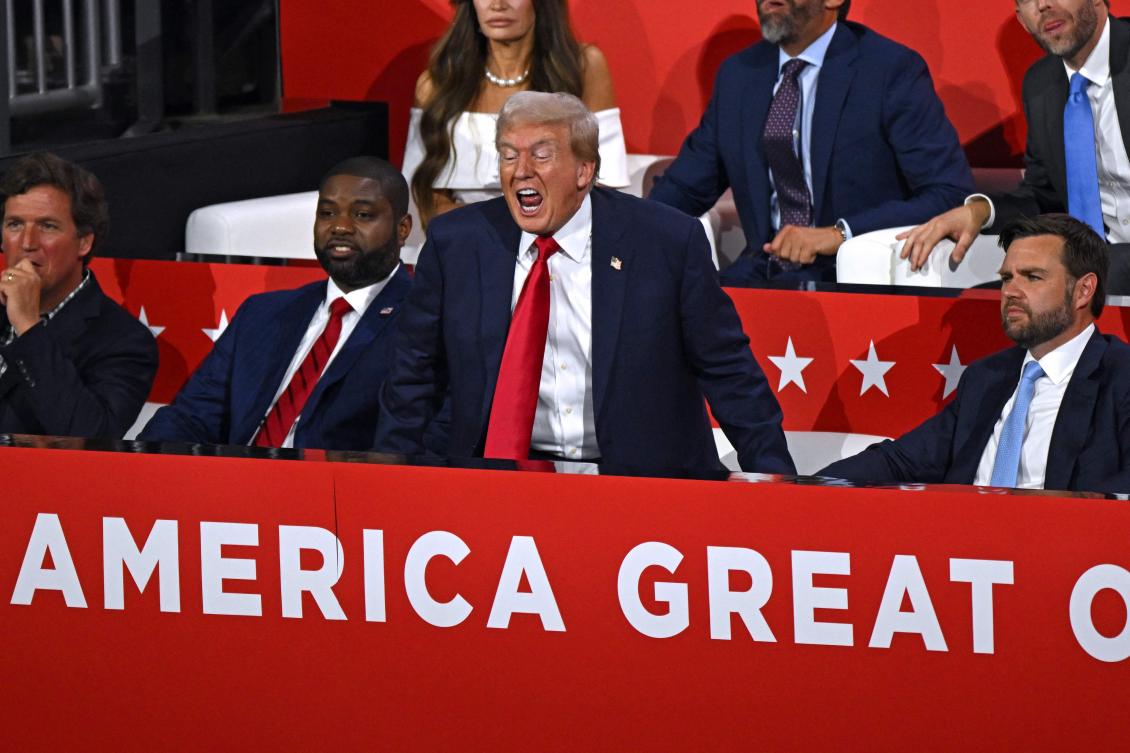 US former President and 2024 Republican presidential candidate Donald Trump (C) shouts next to US Senator from Ohio and 2024 Republican vice-president candidate J. D. Vance (R). (AFP)