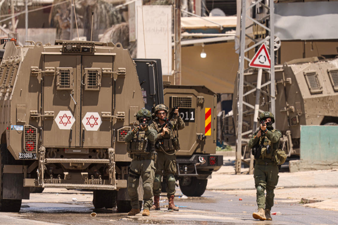 Israeli army soldiers take position during a raid in the Nur Shams camp for Palestinian refugees in the occupied West Bank. (File/AFP)