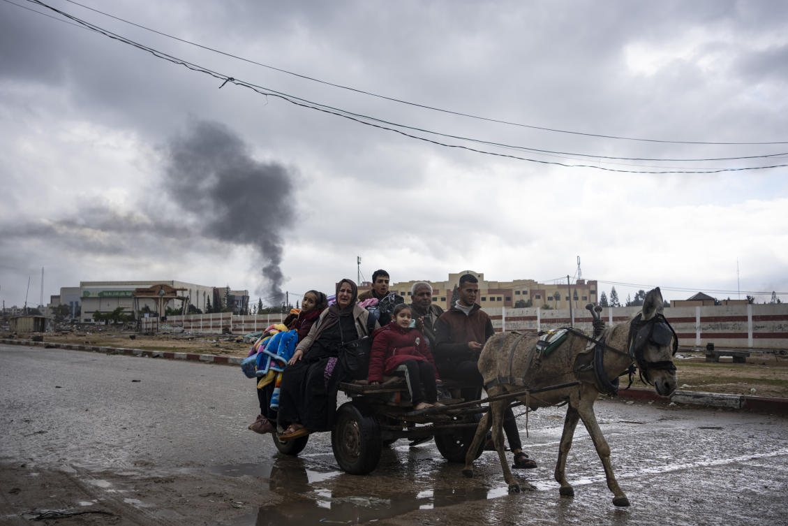 Palestinians flee from the city of Khan Younis in southern Gaza after an Israeli ground and air offensive. (File/AP)