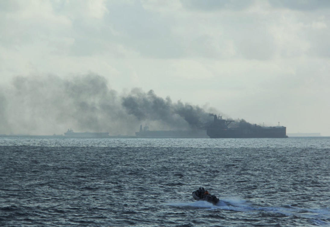 A handout image shows the RSS Supreme’s rigid-hulled inflatable boat in the vicinity of the burning vessels following a fire on two oil tankers about 55km northeast of the Singaporean island of Pedra Branca on July 19, 2024. (Singapore Navy via Reuters)