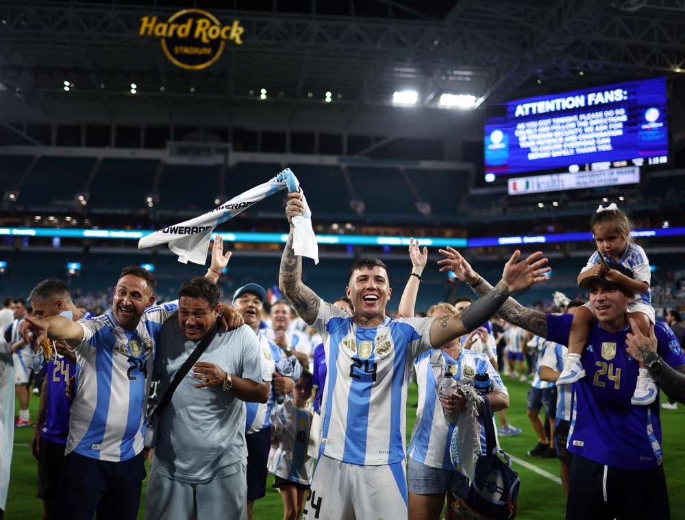 Argentina's Enzo Fernandez celebrates with family after winning the Copa America. (Reuters)