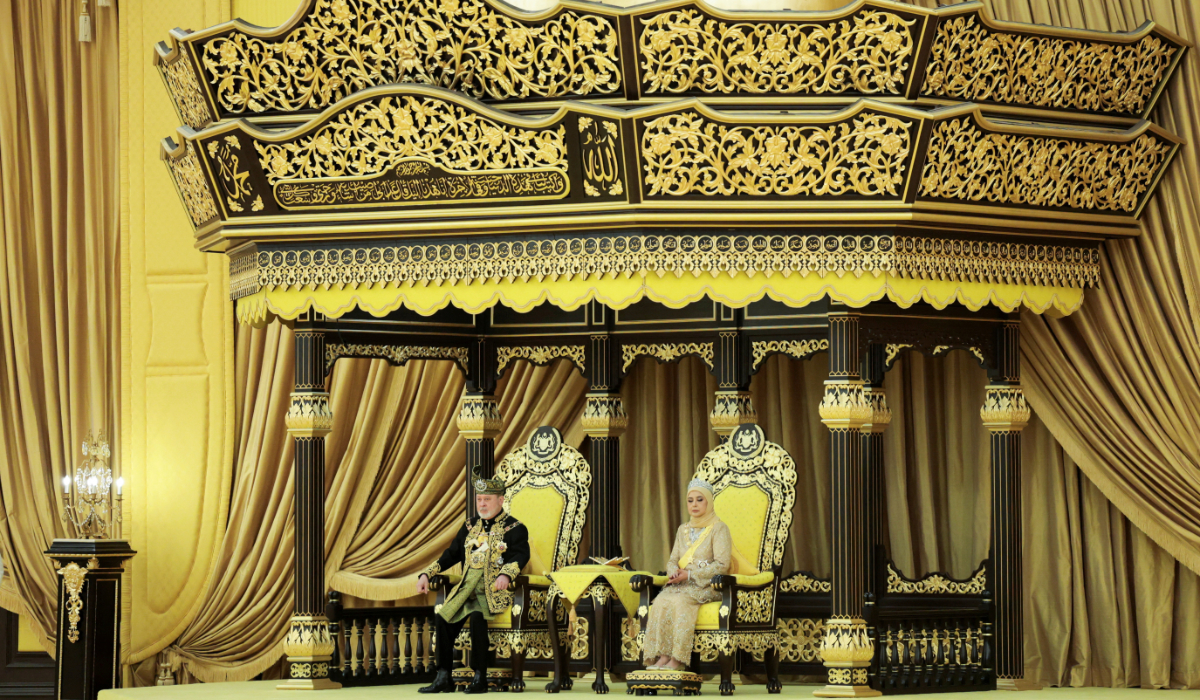 King Sultan Ibrahim Sultan Iskandar and Queen Raja Zarith Sofiah Idris Shah sit on their thrones during the coronation on Saturday. (Reuters)