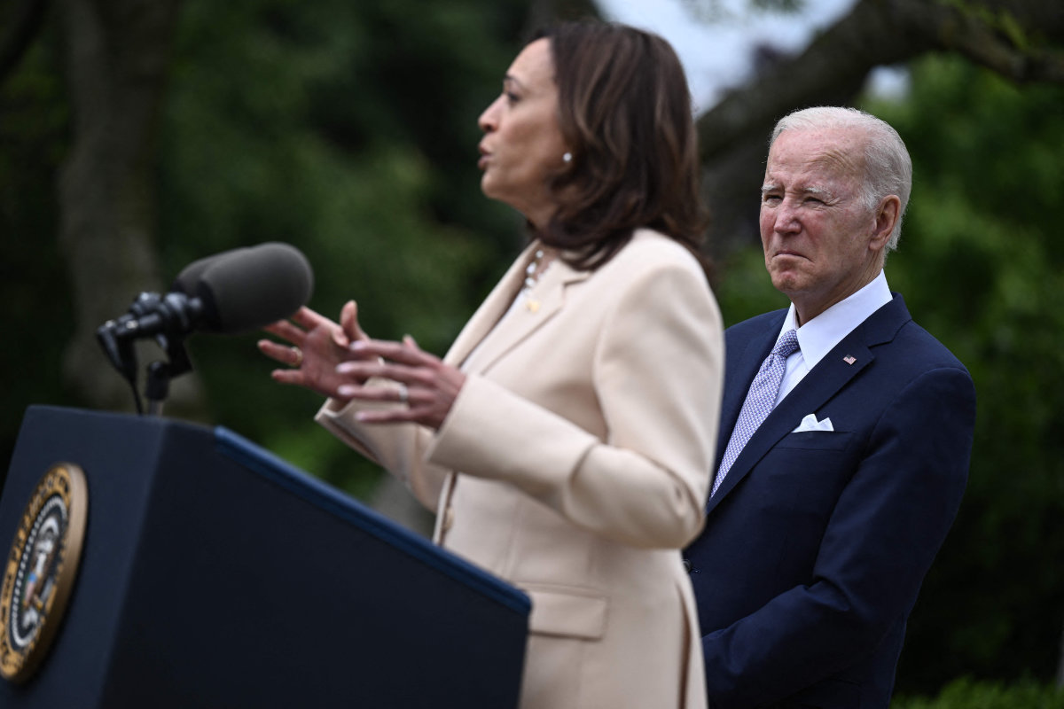 US Vice President Kamala Harris delivers remarks and President Joe Biden listens during an event in the White House on May 1, 2023. Donald Trump is saying Biden's failings are also Harris' failings. (AFP/File)