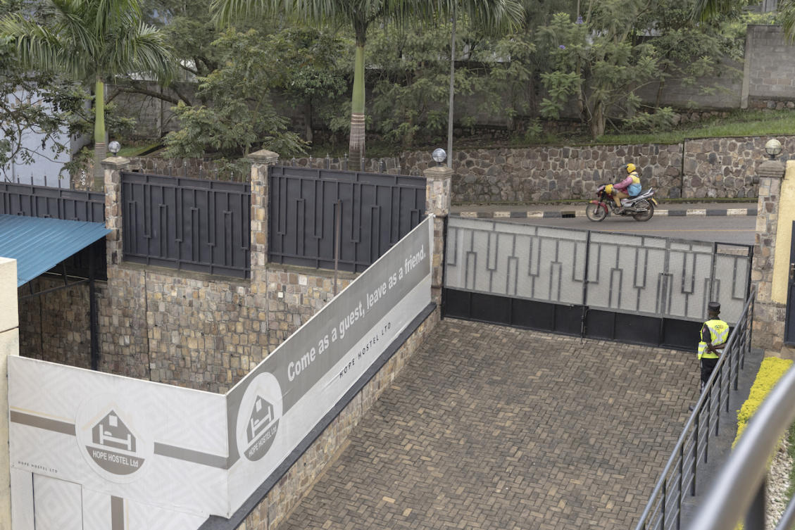 A general view of a welcome sign next to the entrance gate at Hope Hostel, which was prepared to host migrants from UK, in Kigali. (File/AFP)