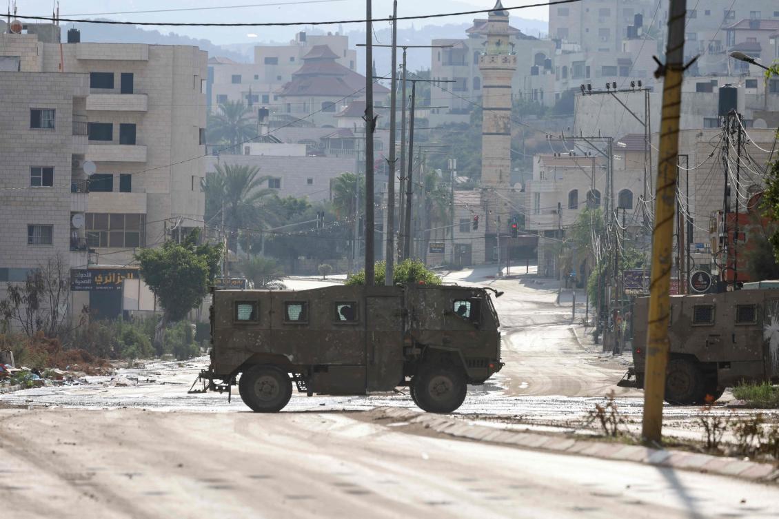 An Israeli army armoured vehicle drives during a raid in the Tulkarem camp for Palestinian refugees in the occupied West Bank on July 23, 2024. (AFP)