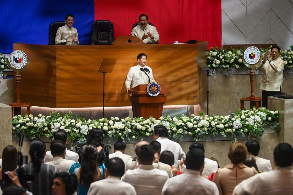 Philippine President Ferdinand Marcos Jr., center, gives his annual State of the Nation Address at the House of Representatives in Manila on July 22, 2024. (AFP)