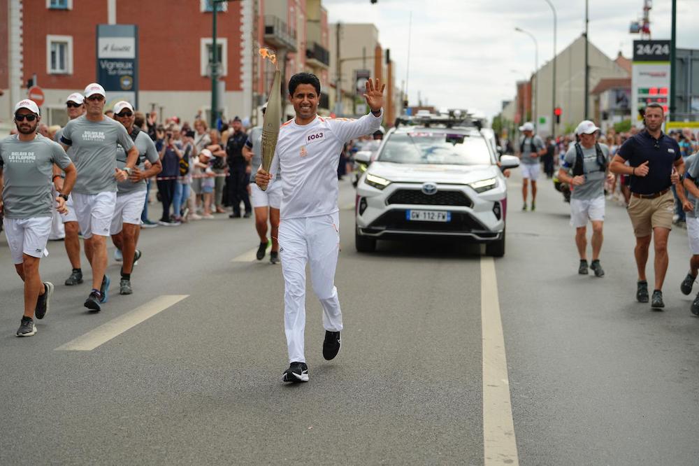 Nasser Al-Khelaifi, president of Paris Saint-Germain, takes part in the Olympic Torch Relay on Monday afternoon. (Supplied)