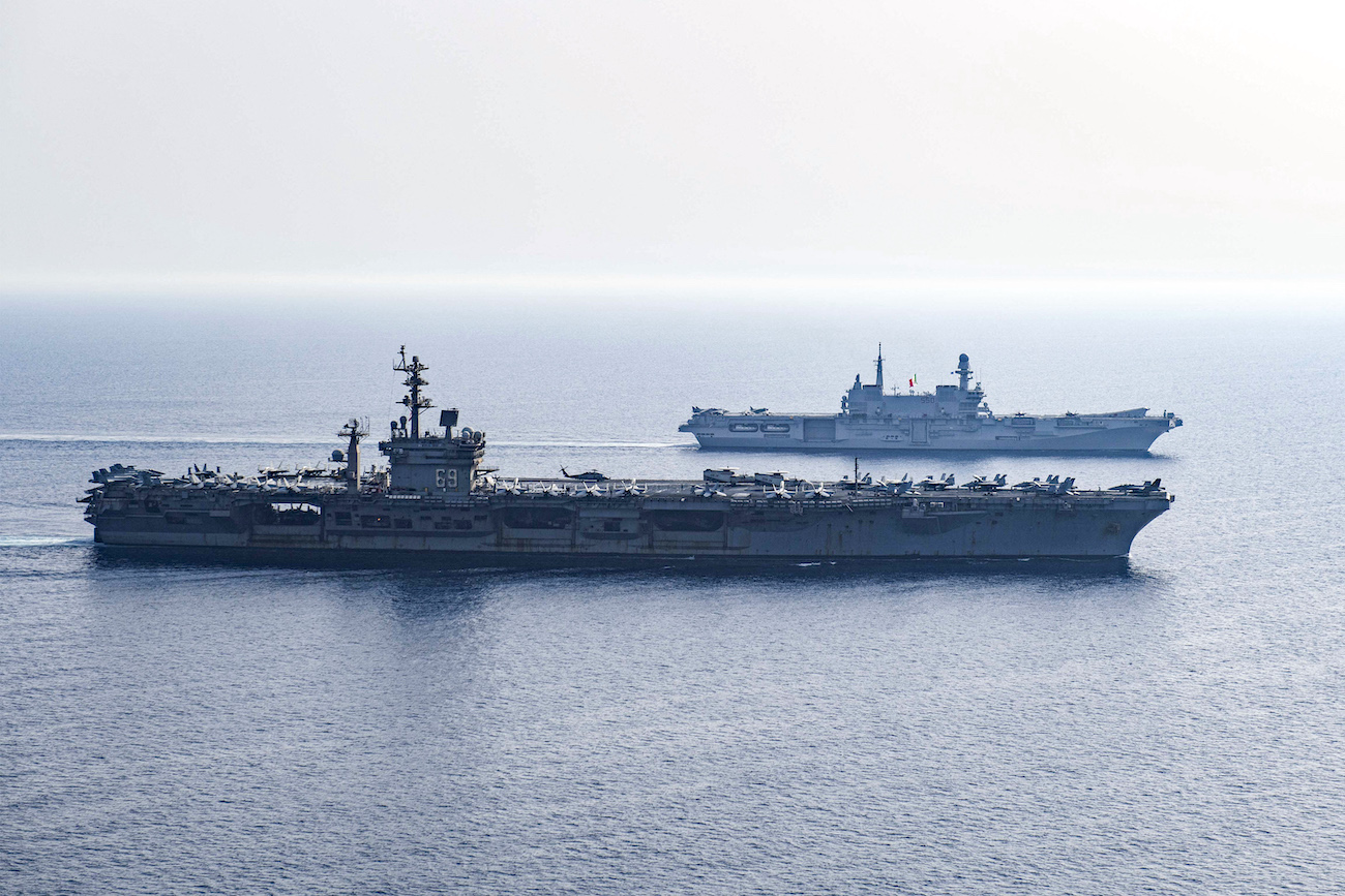 US Navy Nimitz-class aircraft carrier USS Dwight D. Eisenhower (CVN 69) and Italian aircraft carrier ITS Cavour (CVH 550) sail in formation in Red Sea as part of mission to support maritime security in Middle East region. (File/AFP)