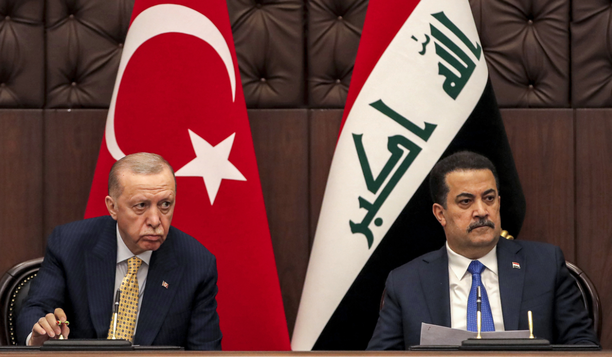 Iraq's Prime Minister Mohammed Shia al-Sudani, right, and Turkey's President Recep Tayyip Erdogan attend a meeting to sign mutual agreements in Baghdad, on April 22, 2024. (AP)