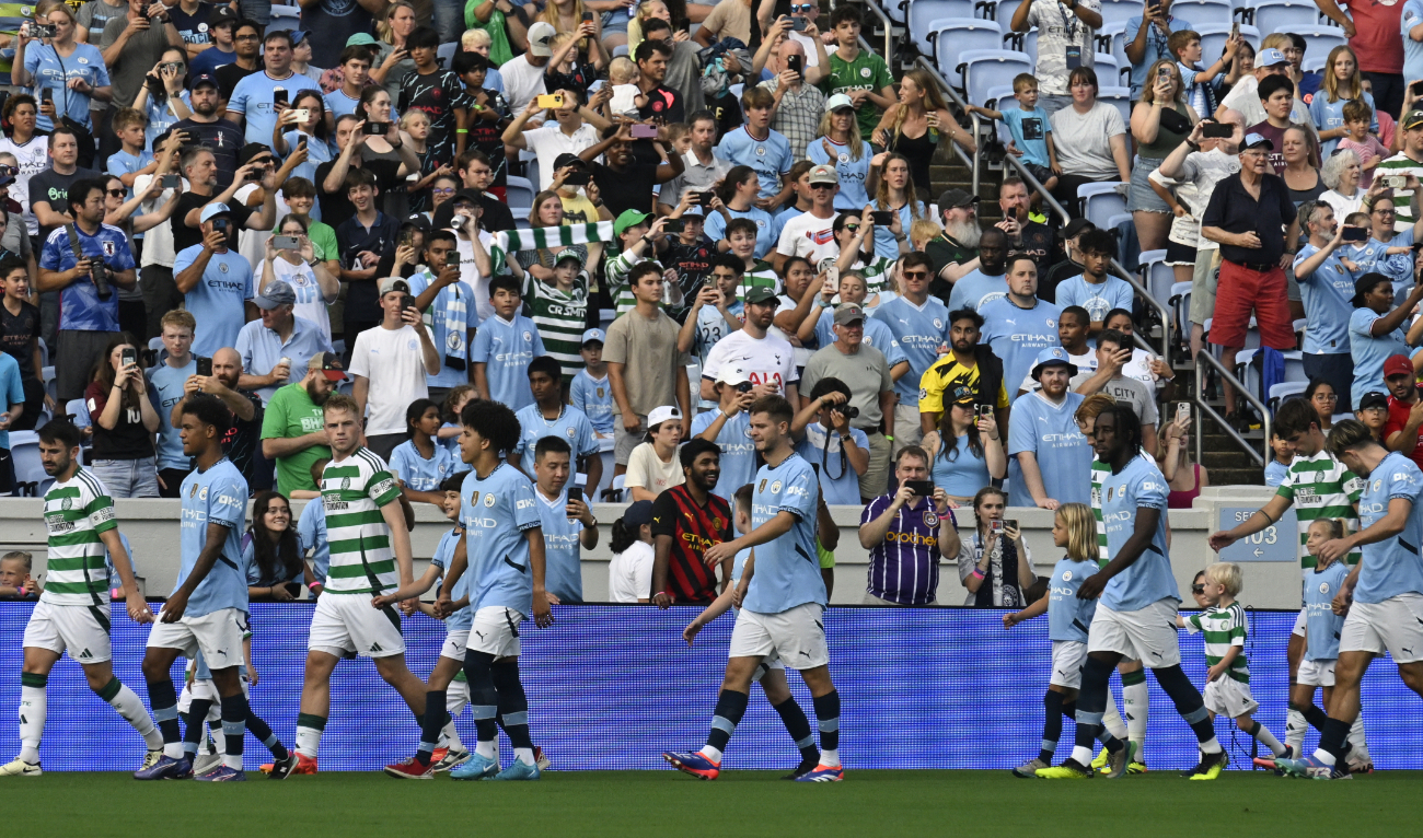 Players walk out on the pitch for the 2024 FC Series pre-season friendly football match between Manchester City and Celtic at the Kenan Memorial Stadium in Chapel Hill, North Carolina, July 23, 2024. (AFP)