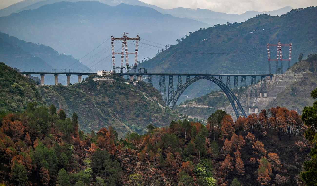 This photograph taken on July 6, 2024, shows a general view of Chenab bridge, the world's highest rail arch bridge in Reasi, Jammu and Kashmir. (AFP)