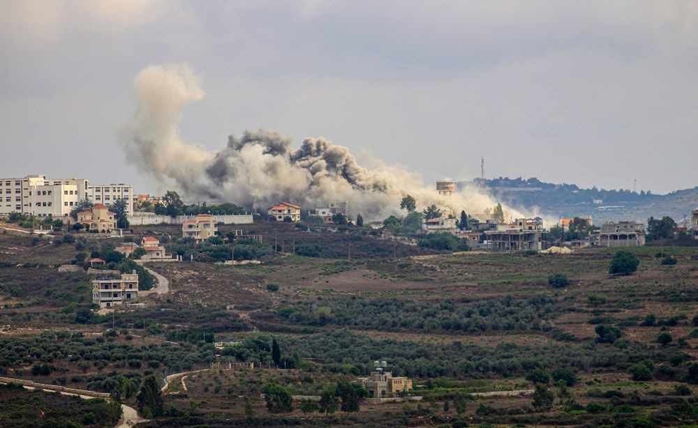 Smoke billows from a site targeted by Israeli shelling in the southern Lebanese border village of Tayr Harfa on July 24, 2024. (AFP)