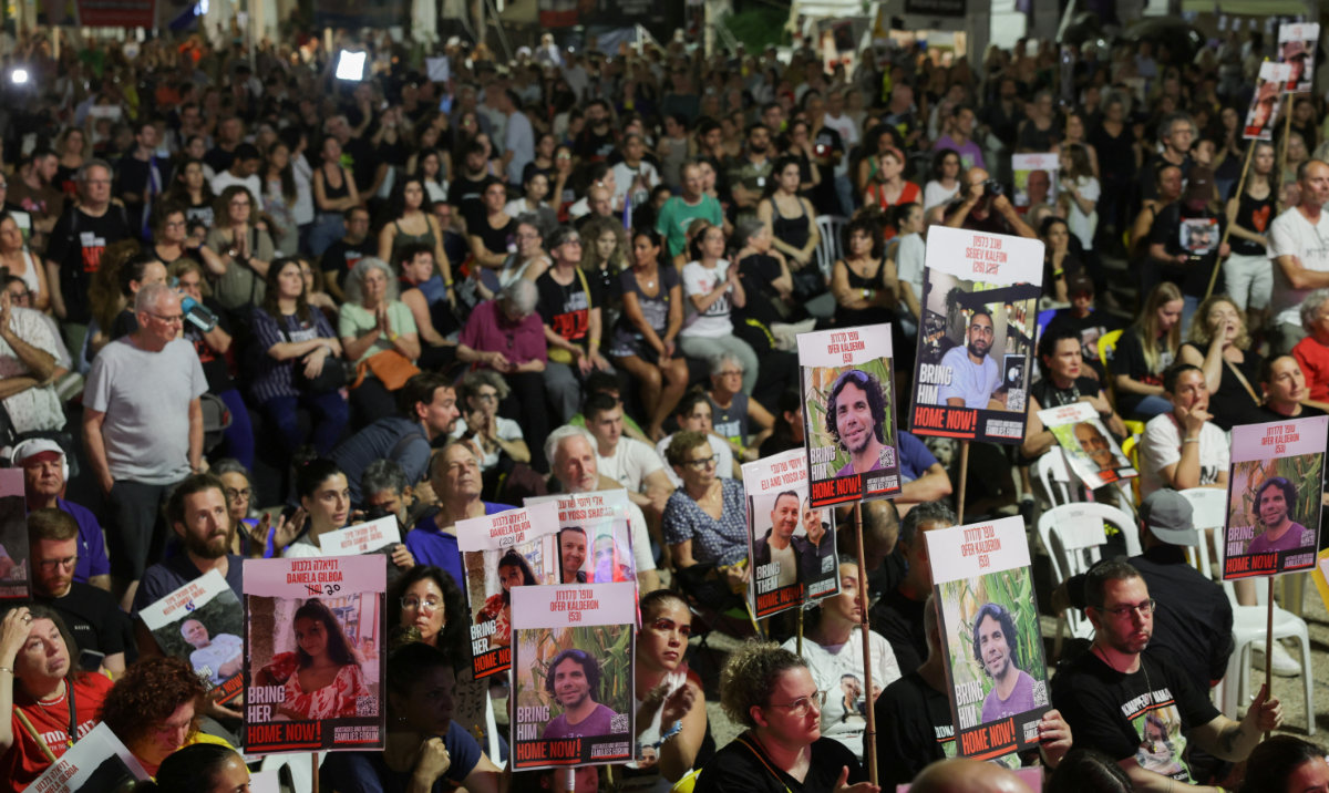 Israelis and hostage families watch a screening of Israeli Prime Minister Benjamin Netanyahu as he addresses Congress on a visit to the U.S., amid the ongoing conflict in Gaza between Israel and Hamas, at the so-called "Hostages Square", in Tel Aviv, Israel, July 24, 2024. (Reuters)