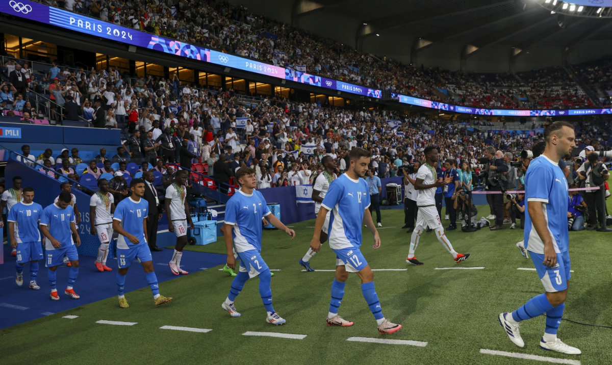 Israel walk on to the pitch ahead of the men's group D match between Israel and Mali at the Parc des Princes during the 2024 Summer Olympics, Wednesday, July 24, 2024, in Paris, France. (AP)