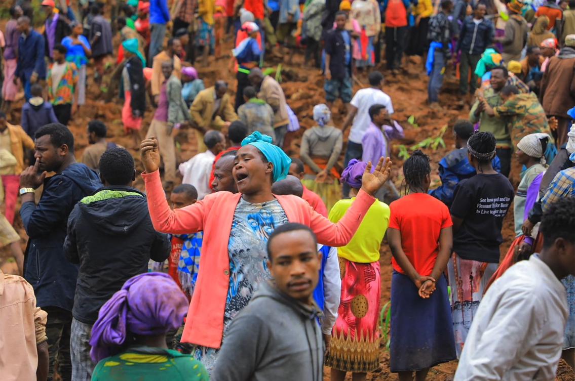 Above, people stand at the bottom of a landslide that occurred in the Geze-Gofa district in southern Ethiopia. (Gofa Zone Government Communication Affairs Department/AFP)