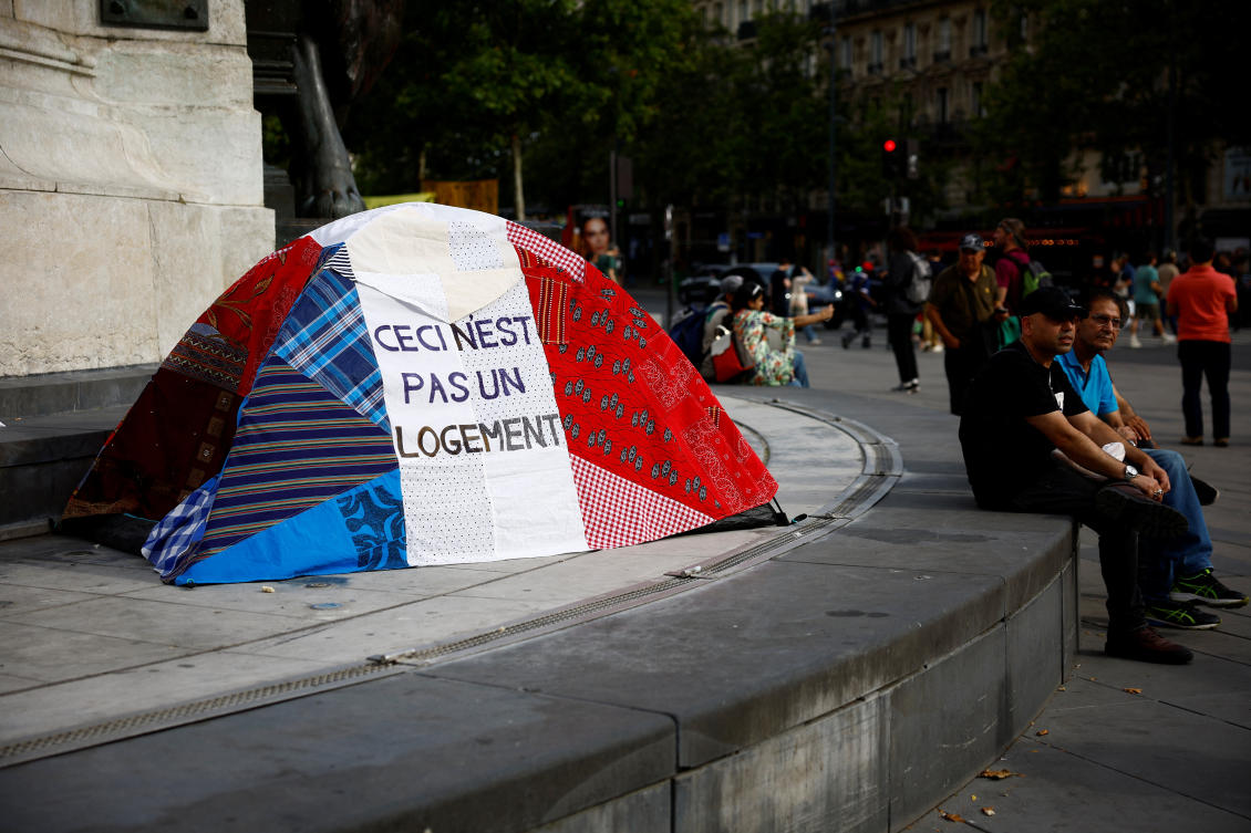 A tent in the colors of the French flag with the slogan ‘This is not housing’ as social and environmental activists gather in a protest at Place de la Republique in Paris, France, July 25, 2024. (Reuters)