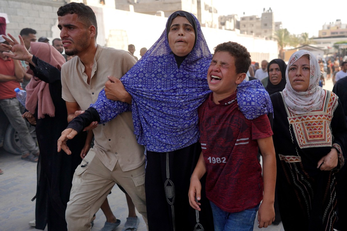 istressed Palestinians arrive at the Nasser hospital after Israeli forces targeted the northeastern district of Khan Yunis, in the southern Gaza Strip, on July 24, 2024 (AFP)