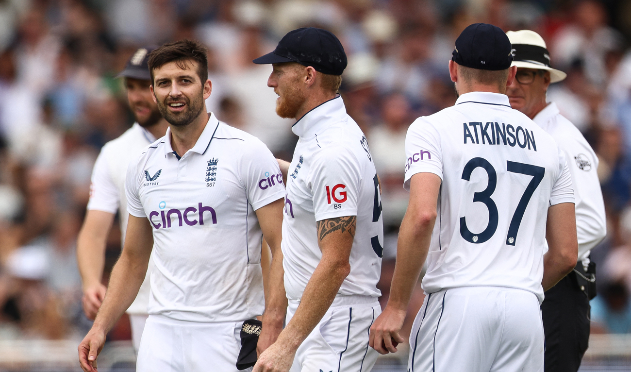 England's Mark Wood (L) and England's captain Ben Stokes react at the end of the innings on the third day of the second Test cricket match between England and West Indies at Trent Bridge in Nottingham on July 20, 2024. (AFP)