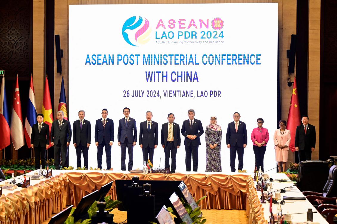 ASEAN foreign ministers with Chinese counterpart Wang Yi, sixth from left, during the ASEAN Post Ministerial Conference with China in Vientiane on July 26, 2024. (AFP)