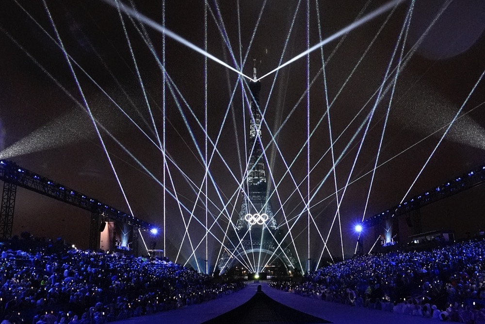 Amid downpour, Paris welcomes the world with unique Olympic opening