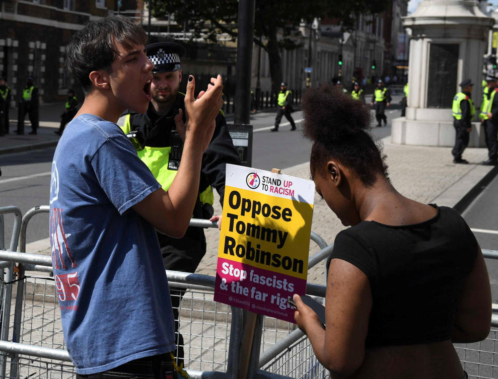 A police officer stands guard as counter-protesters against Tommy Robinson demonstrate during a march organised by Stand Up To Racism and other groups, in London on Jul. 27, 2024. (Reuters)