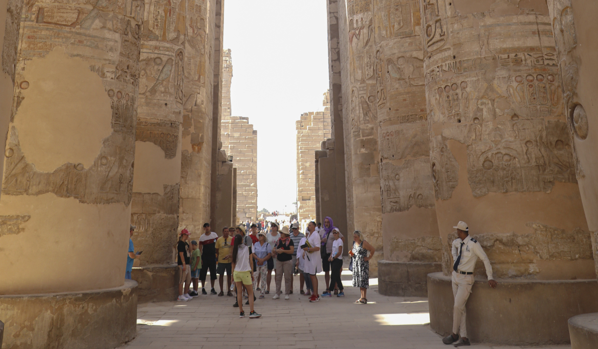 Tourists visit the Karnak Temple on Friday, Nov. 26, 2021, After one day the reopening ceremony of the Avenue of Sphinxes commonly known as El Kebbash Road in Luxor, Egypt. (AP file photo)