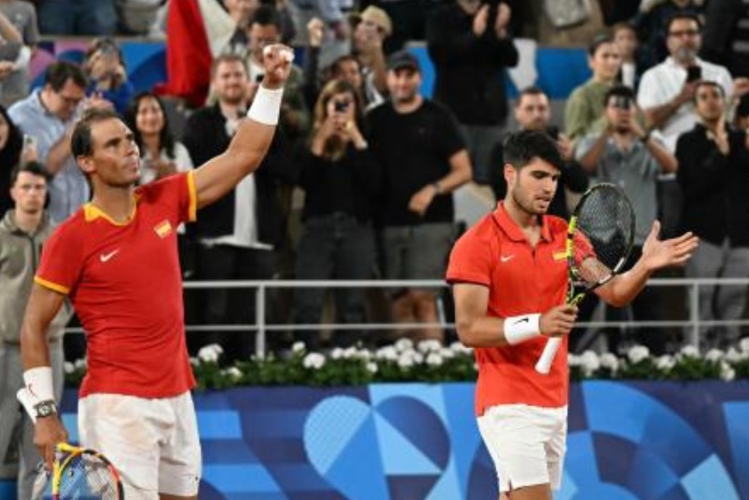Spain’s Rafael Nadal and Carlos Alcaraz celebrate after beating Argentina’s Maximo Gonzalez and Argentina’s Andres Molteni in their men’s doubles first round tennis match on Court Philippe-Chatrier at the Roland-Garros Stadium at the Paris 2024 Olympic Games on Jul. 27, 2024. (AFP)
