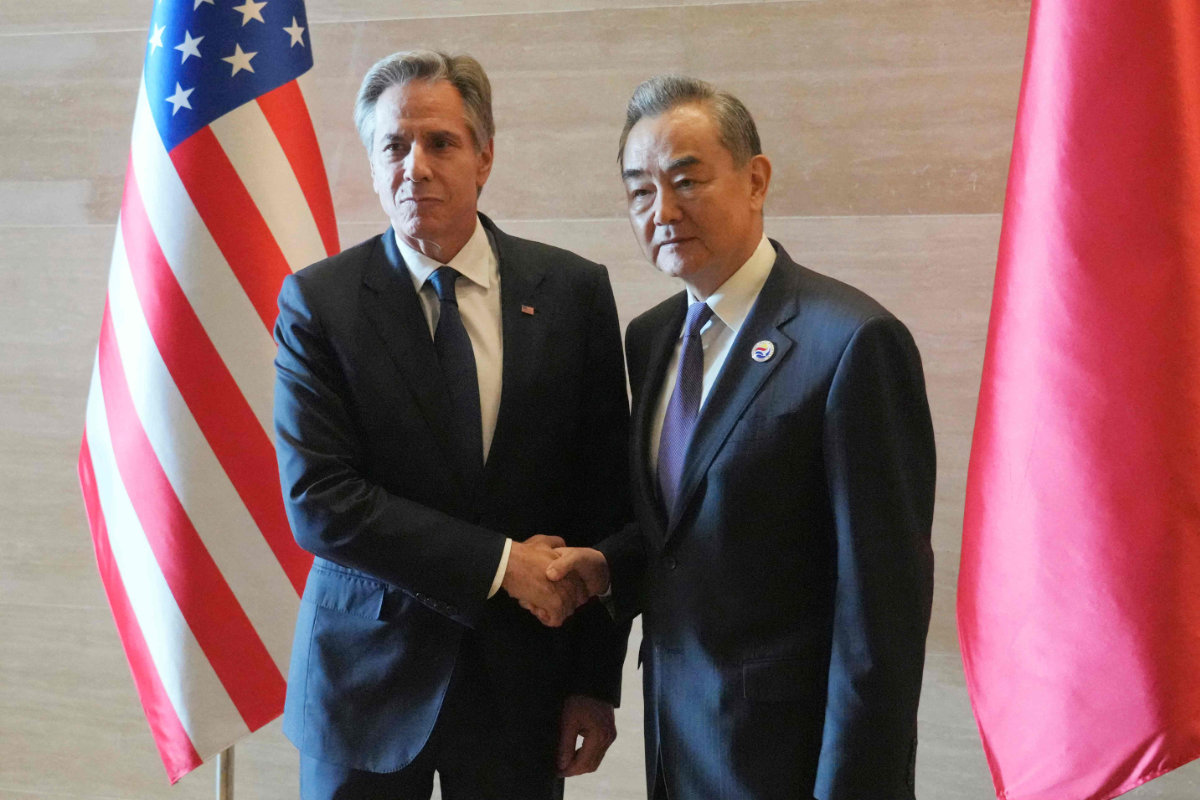 US Secretary of State Antony Blinken (L) shakes hands with China's Foreign Minister Wang Yi as they meet on the sidelines of the 57th ASEAN Foreign Ministers' Meeting in Vientiane, Laos, on July 27, 2024. (POOL/AFP)
