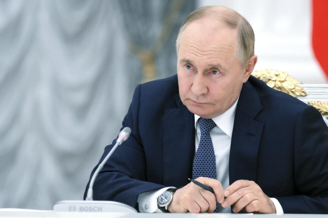 “If the United States carries out such plans, we will consider ourselves liberated from the unilateral moratorium previously adopted on the deployment of medium- and short-range strike capabilities,” Putin said during a naval parade in Saint Petersburg. (AP)