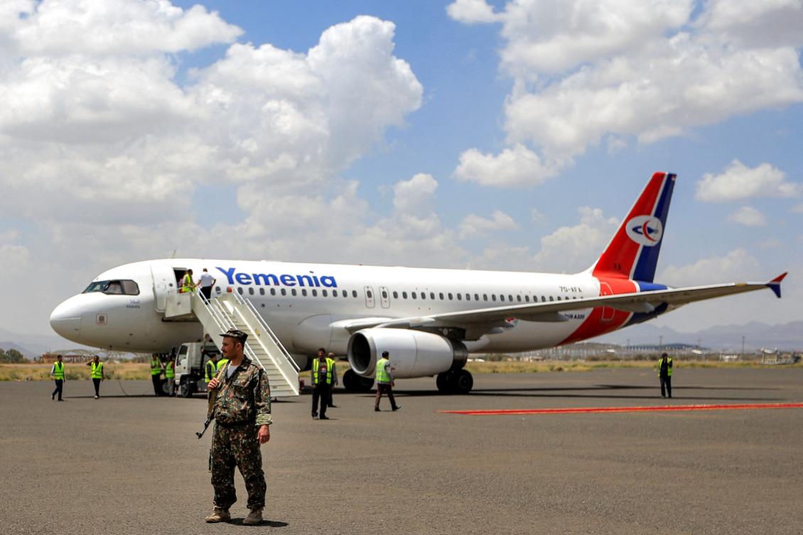 Security forces and airport staff gather outside a Yemenia Airways Airbus A320 aircraft. (File/AFP)